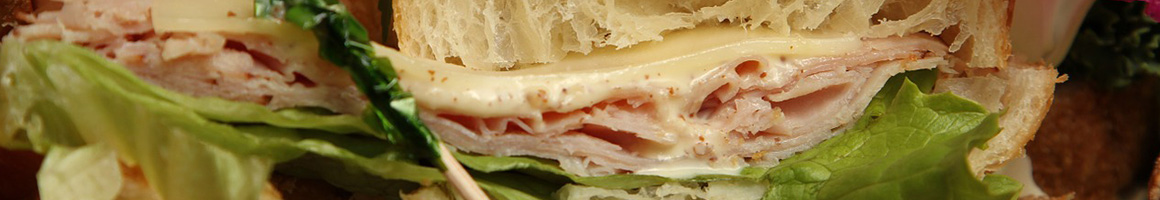 Eating Deli Sandwich at Little Deli Mart restaurant in Seattle, WA.